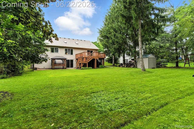 22288 Cass St, Farmington, MI 48335 - view of green lawn featuring a shed, a wooden deck, and stairs