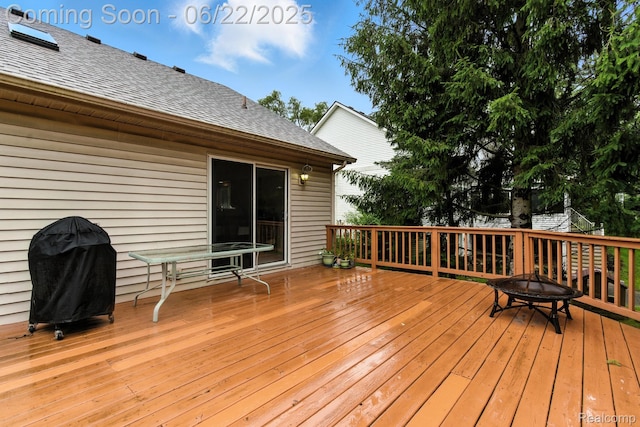 22288 Cass St, Farmington, MI 48335 - wooden terrace with a grill and a fire pit