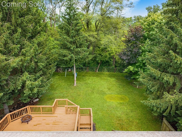 22288 Cass St, Farmington, MI 48335 - view of grassy yard with a deck