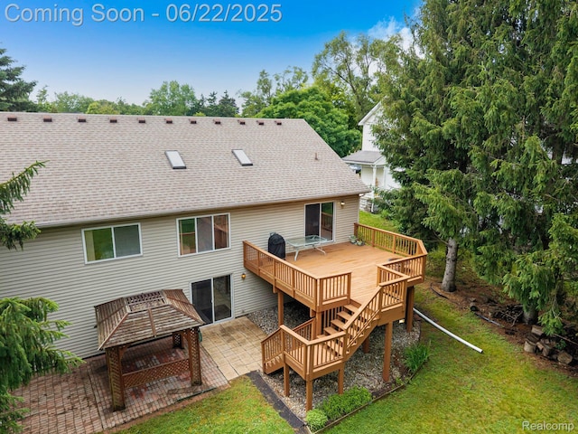 22288 Cass St, Farmington, MI 48335 - back of house with a deck, a shingled roof, a yard, and a patio