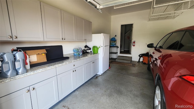 2315 Willow Ln, Grand Blanc, MI 48439 - garage with freestanding refrigerator