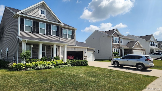 2315 Willow Ln, Grand Blanc, MI 48439 - craftsman-style house featuring driveway, stone siding, a front lawn, and a garage