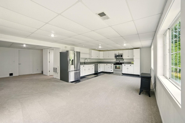 2350 155th Ave, Morley, MI 49336 - unfurnished living room with dark carpet, a paneled ceiling, and recessed lighting