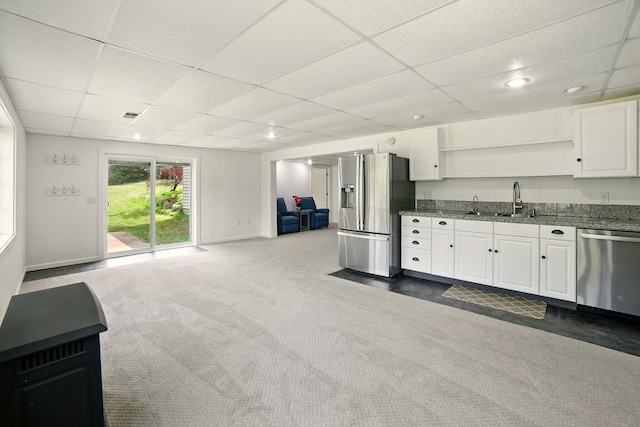2350 155th Ave, Morley, MI 49336 - kitchen with stainless steel appliances, a drop ceiling, open shelves, white cabinetry, and open floor plan