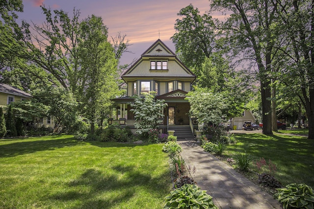 73640 Fulton St, Armada, MI 48005 - victorian-style house featuring covered porch and a yard