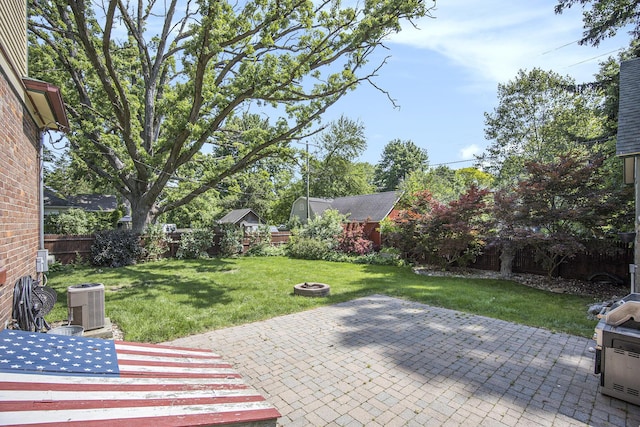 73640 Fulton St, Armada, MI 48005 - fenced backyard with a patio area and a fire pit