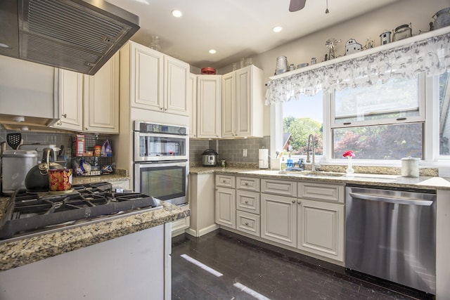 73640 Fulton St, Armada, MI 48005 - kitchen featuring stainless steel appliances, exhaust hood, backsplash, recessed lighting, and light stone countertops