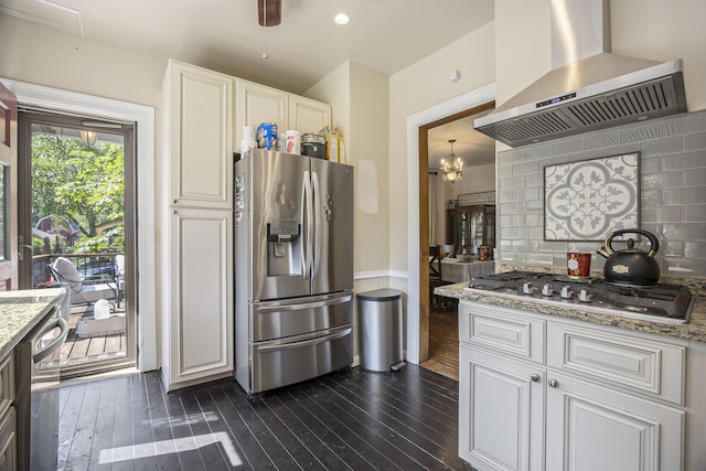 73640 Fulton St, Armada, MI 48005 - kitchen with wall chimney range hood, stainless steel appliances, dark wood-type flooring, and light stone counters