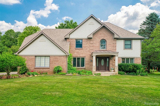 24810 Nottingham Dr, Novi, MI 48374 - view of front of property featuring brick siding and a front yard