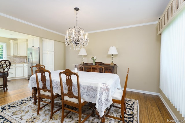 24810 Nottingham Dr, Novi, MI 48374 - dining space featuring crown molding, wood finished floors, and a chandelier