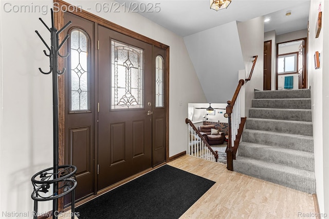 1306 Bishops Ter, Wixom, MI 48393 - foyer featuring stairway and light wood-style flooring