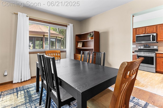 1306 Bishops Ter, Wixom, MI 48393 - dining space featuring light wood finished floors
