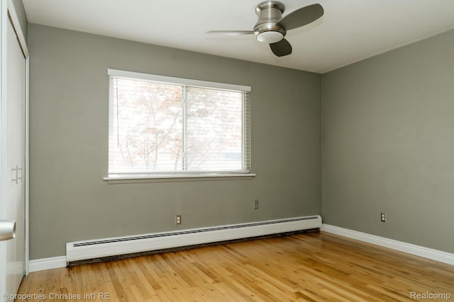 1715 E 14 Mile Rd, Birmingham, MI 48009 - unfurnished room featuring baseboard heating, ceiling fan, and wood finished floors