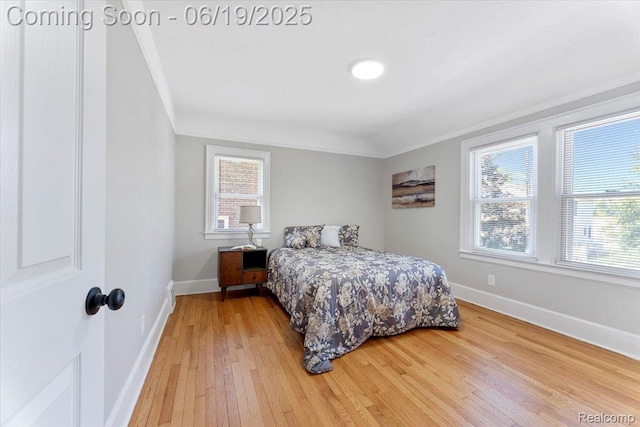 243 2nd St, Brownstown, MI 48192 - bedroom featuring crown molding, light wood-style floors, and multiple windows