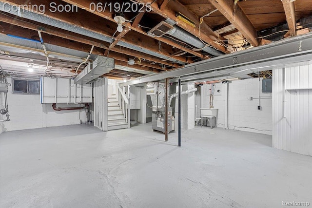 243 2nd St, Brownstown, MI 48192 - unfinished basement with stairway, electric panel, and heating unit