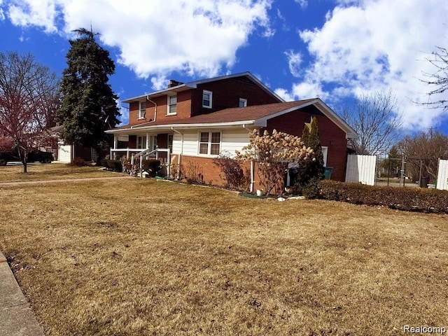664 Buckingham Ave, Lincoln Park, MI 48146 - view of property exterior featuring covered porch, brick siding, a chimney, and a garage
