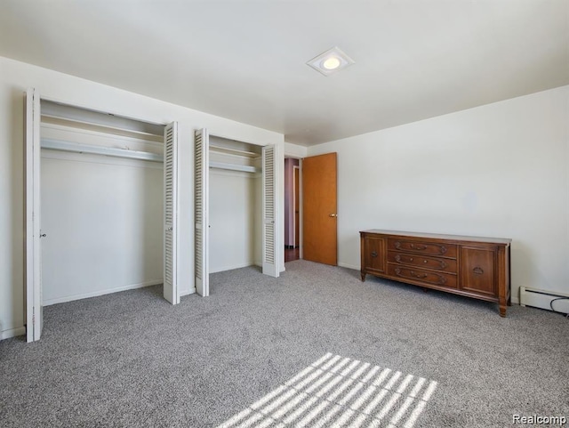 664 Buckingham Ave, Lincoln Park, MI 48146 - unfurnished bedroom with two closets, carpet, and a baseboard heating unit