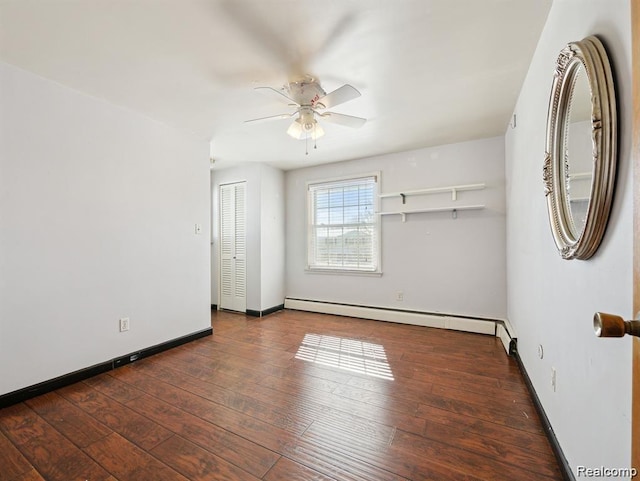 664 Buckingham Ave, Lincoln Park, MI 48146 - spare room with a baseboard radiator, a ceiling fan, and wood-type flooring