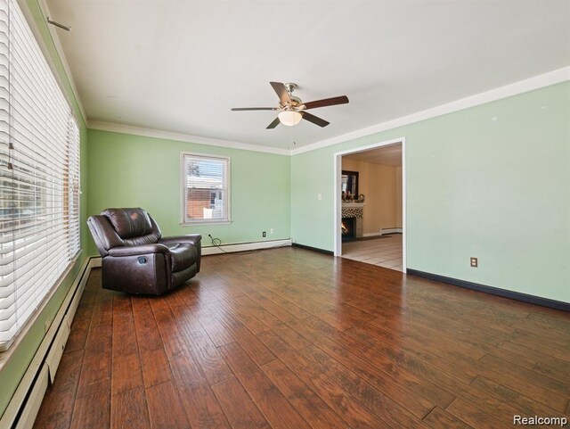664 Buckingham Ave, Lincoln Park, MI 48146 - unfurnished room with a baseboard radiator, crown molding, a ceiling fan, and hardwood / wood-style floors