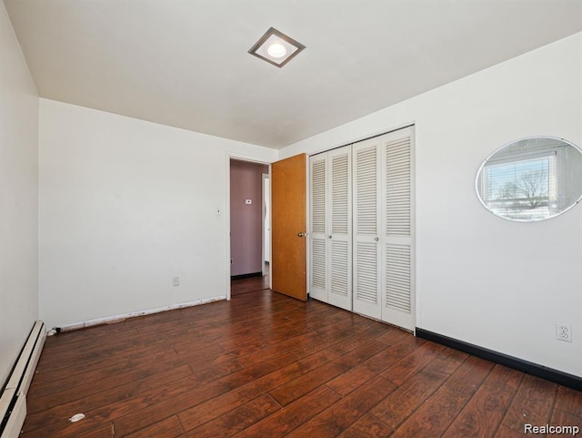 664 Buckingham Ave, Lincoln Park, MI 48146 - unfurnished bedroom featuring a baseboard radiator, hardwood / wood-style floors, and a closet