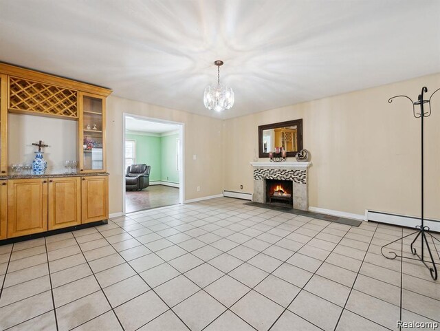 664 Buckingham Ave, Lincoln Park, MI 48146 - living area featuring a baseboard heating unit, baseboard heating, a chandelier, a fireplace, and light tile patterned flooring