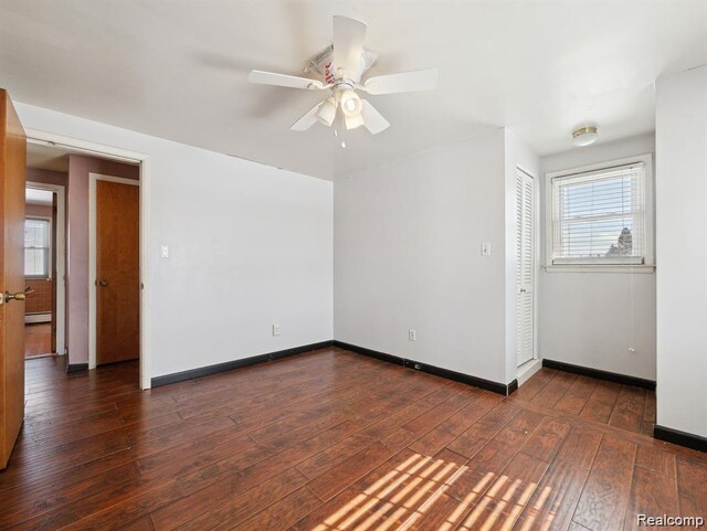 664 Buckingham Ave, Lincoln Park, MI 48146 - unfurnished room with wood-type flooring, a baseboard radiator, and a ceiling fan