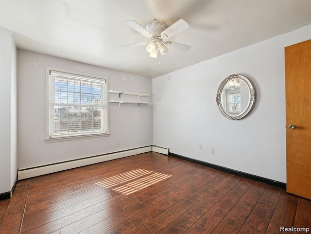 664 Buckingham Ave, Lincoln Park, MI 48146 - empty room with a ceiling fan, a baseboard heating unit, and dark wood-type flooring