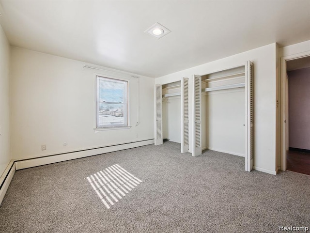 664 Buckingham Ave, Lincoln Park, MI 48146 - unfurnished bedroom featuring multiple closets, carpet floors, and baseboard heating