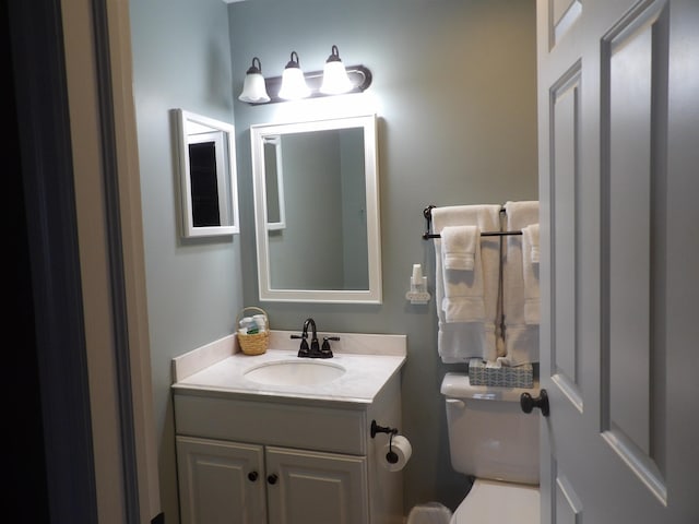 1246 Sunnyside Dr, Cadillac, MI 49601 - bathroom featuring vanity and toilet