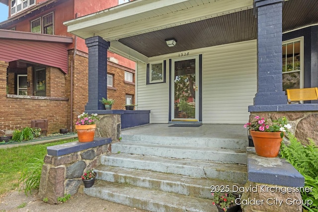 1328 Bemis St SE, Grand Rapids, MI 49506 - entrance to property featuring a porch and brick siding