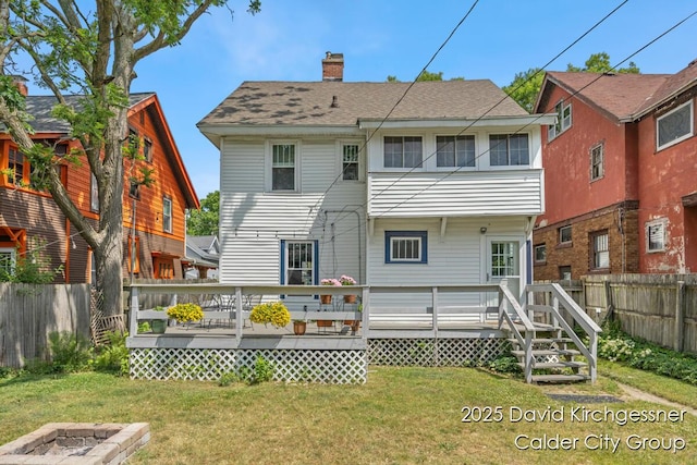 1328 Bemis St SE, Grand Rapids, MI 49506 - back of house with a chimney, a wooden deck, and roof with shingles