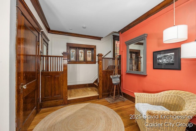 1328 Bemis St SE, Grand Rapids, MI 49506 - living area with wood finished floors, stairway, and ornamental molding