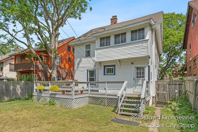 1328 Bemis St SE, Grand Rapids, MI 49506 - back of property with a chimney, a fenced backyard, and a wooden deck