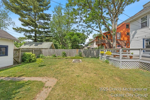 1328 Bemis St SE, Grand Rapids, MI 49506 - fenced backyard featuring a fire pit and a deck