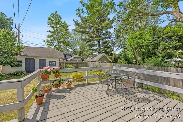 1328 Bemis St SE, Grand Rapids, MI 49506 - wooden deck with a fenced backyard and outdoor dining area