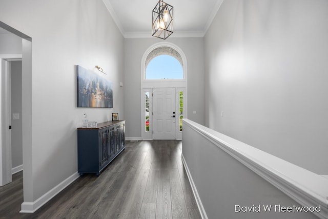 6935 Fairway Vista Dr SE, Caledonia, MI 49316 - foyer featuring dark wood-style flooring and ornamental molding