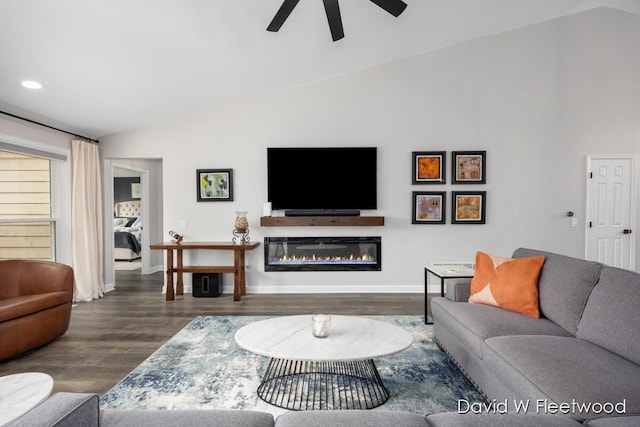 6935 Fairway Vista Dr SE, Caledonia, MI 49316 - living area with vaulted ceiling, ceiling fan, wood finished floors, a glass covered fireplace, and recessed lighting