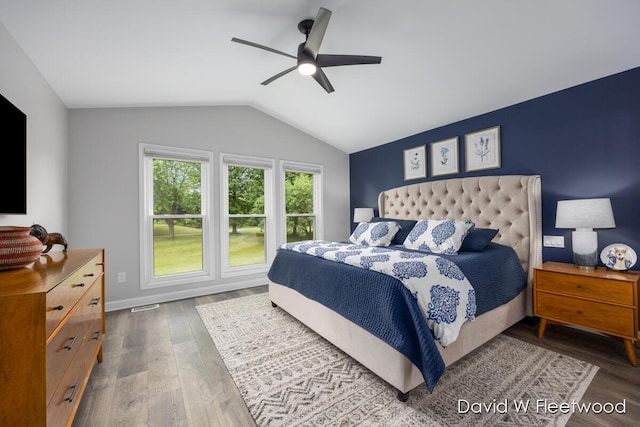 6935 Fairway Vista Dr SE, Caledonia, MI 49316 - bedroom featuring wood finished floors, vaulted ceiling, and ceiling fan