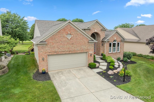 6935 Fairway Vista Dr SE, Caledonia, MI 49316 - traditional-style house featuring brick siding, concrete driveway, a front lawn, and a garage