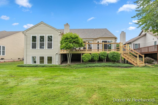 6935 Fairway Vista Dr SE, Caledonia, MI 49316 - rear view of property featuring a wooden deck, a yard, a chimney, and stairway