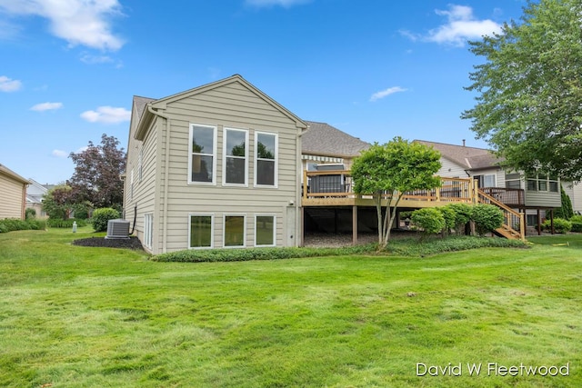 6935 Fairway Vista Dr SE, Caledonia, MI 49316 - back of house featuring a wooden deck and a lawn