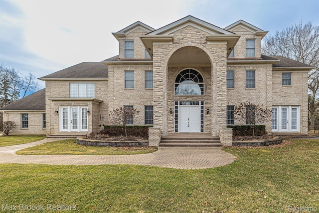 5626 Shadow Ln, Bloomfield Hills, MI 48302 - view of front of house with french doors, a front lawn, and brick siding