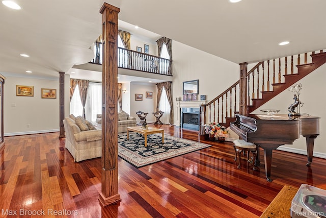 5626 Shadow Ln, Bloomfield Hills, MI 48302 - living room featuring decorative columns, wood finished floors, stairway, recessed lighting, and a fireplace