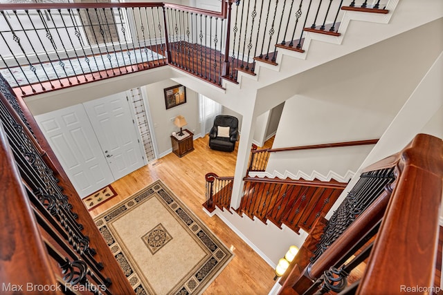 5626 Shadow Ln, Bloomfield Hills, MI 48302 - stairs featuring wood finished floors and a high ceiling