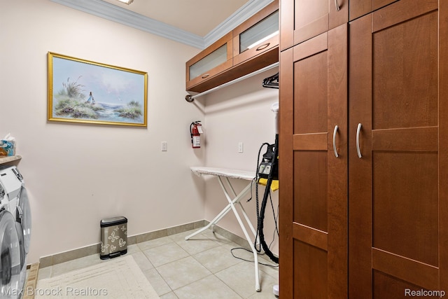 5626 Shadow Ln, Bloomfield Hills, MI 48302 - laundry area featuring independent washer and dryer, cabinet space, crown molding, and light tile patterned floors