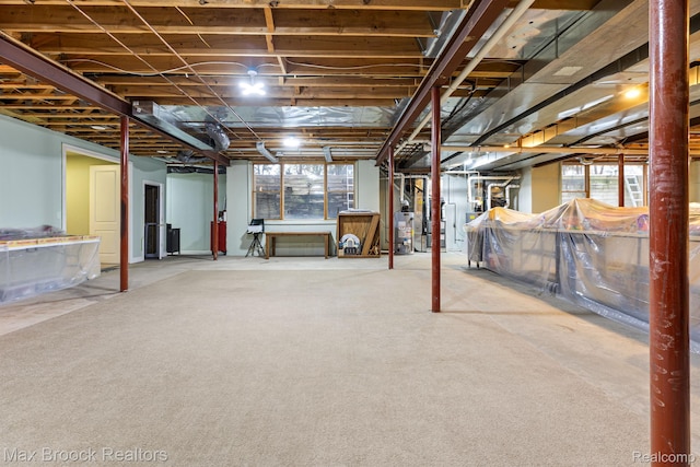 5626 Shadow Ln, Bloomfield Hills, MI 48302 - basement featuring gas water heater, healthy amount of natural light, and carpet flooring