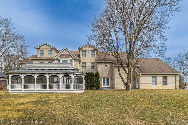 5626 Shadow Ln, Bloomfield Hills, MI 48302 - rear view of house featuring a yard and brick siding