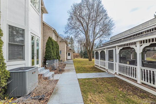 5626 Shadow Ln, Bloomfield Hills, MI 48302 - view of grassy yard with french doors and a sunroom