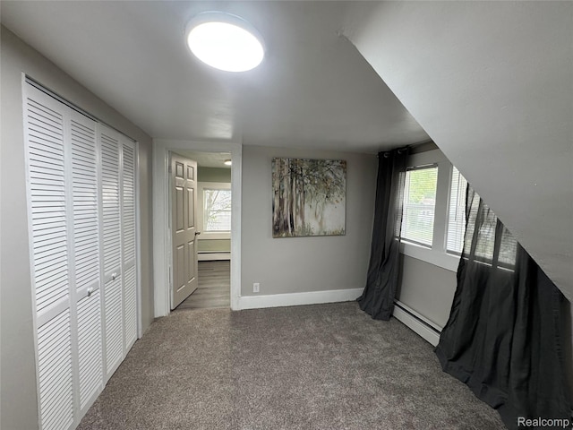 1741 Academy St, Ferndale, MI 48220 - unfurnished bedroom featuring a baseboard radiator, carpet, connected bathroom, and a closet