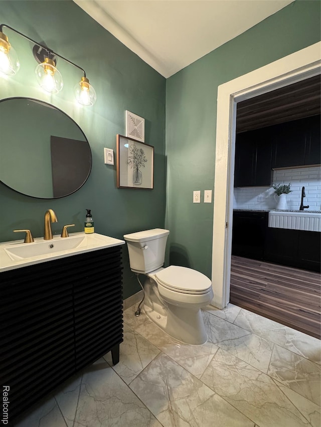 1741 Academy St, Ferndale, MI 48220 - bathroom featuring marble finish flooring, vanity, and tasteful backsplash